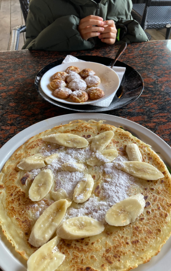 Eating pancake at Poffertjes